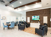Thumbnail 3 of 9 - A living room with a wooden wall and a large clock on the wall.