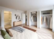 Thumbnail 9 of 26 - a bedroom with a bed and a closet