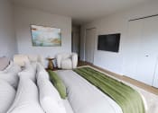 Thumbnail 26 of 26 - a bedroom with a large bed and a tv