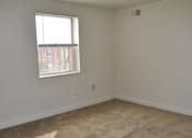 Thumbnail 31 of 39 - A room with a window and a wall socket.