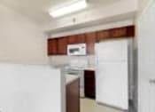 Thumbnail 32 of 137 - a kitchen with a refrigerator and a sink