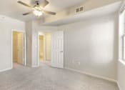 Thumbnail 84 of 137 - an empty living room with a ceiling fan