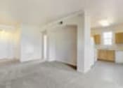 Thumbnail 1 of 137 - an empty living room with white walls and no furniture
