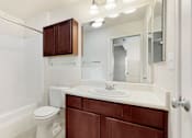 Thumbnail 34 of 137 - a bathroom with a sink toilet and a mirror