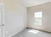 Thumbnail 64 of 137 - an empty room with a window and a door