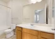 Thumbnail 10 of 137 - a bathroom with a sink and a tub and a mirror