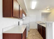 Thumbnail 50 of 137 - a kitchen with marble counters and a large wallpaper with flowers on it