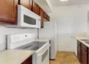Thumbnail 16 of 137 - a kitchen with a sink and a microwave