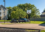 Thumbnail 100 of 137 - a truck parked next to a basketball hoop on the side of a street