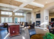 Thumbnail 23 of 137 - a large living room with a fireplace and a table and chairs