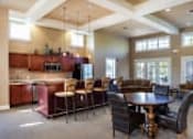 Thumbnail 19 of 137 - a large living room with a table and chairs and a kitchen