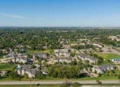 Thumbnail 45 of 137 - an aerial view of a city with houses and trees