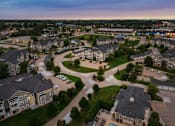 Thumbnail 118 of 137 - an aerial view of a neighborhood with houses and parking lots