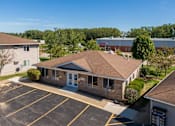 Thumbnail 2 of 38 - an aerial view of a building with a parking lot