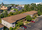 Thumbnail 4 of 38 - an aerial view of a building with cars parked in a parking lot