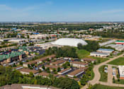 Thumbnail 7 of 38 - an aerial view of a city with a large dome in the background