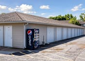 Thumbnail 21 of 38 - a gas station with a vending machine in front of it