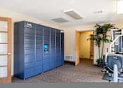 Thumbnail 20 of 38 - a gym with a blue locker room and machines