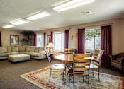 Thumbnail 17 of 38 - a living room with couches chairs and a table