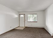 Thumbnail 25 of 38 - an empty room with a door and a window