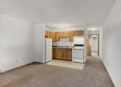 Thumbnail 24 of 38 - an empty kitchen with white appliances and wooden cabinets