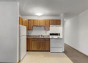 Thumbnail 26 of 38 - an empty kitchen with white appliances and wooden cabinets
