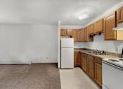 Thumbnail 22 of 38 - a kitchen with white appliances and wooden cabinets