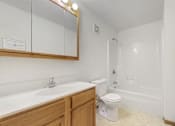 Thumbnail 28 of 38 - a bathroom with a sink and a toilet and a bath tub