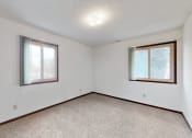 Thumbnail 43 of 45 - the living room of an empty house with two windows