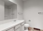 Thumbnail 45 of 45 - a bathroom with a sink toilet and a mirror