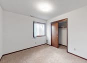 Thumbnail 44 of 45 - an empty living room with a door to a closet