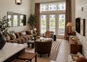 Thumbnail 6 of 16 - A living room with a large window and a view of a building outside.