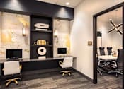 Thumbnail 17 of 25 - A black and white office with a gold and white marble wall at The Olivia Apartments, Carmel, IN