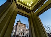 Thumbnail 11 of 16 - A view of a building through a framed opening.