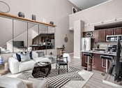 Thumbnail 21 of 35 - A modern living room with a white couch and a black and white rug.