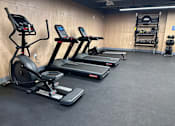 Thumbnail 6 of 14 - Bell Lofts Apartments Fitness Center with treadmills elliptical and exercise bike machines