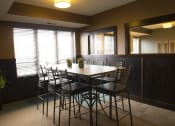 Thumbnail 26 of 33 - a meeting room with a table and chairs at The Flats at Cedar Grove, Minnesota