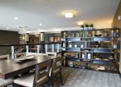 Thumbnail 19 of 33 - a common area with a table and chairs at The Flats at Cedar Grove, Minnesota