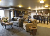 Thumbnail 21 of 33 - a community room filled with furniture and a fire place at The Flats at Cedar Grove, Eagan, MN, 55122