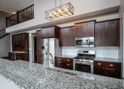Thumbnail 26 of 44 - Designer Kitchen Equipped with Stainless Steal Appliances & Designer Cabinetry  at Victoria Park and V2 Apartments, Minnesota