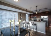 Thumbnail 30 of 44 - a kitchen and dining area  at Victoria Park and V2 Apartments, St. Paul, MN