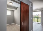 Thumbnail 18 of 44 - a bedroom with a sliding door  at Victoria Park and V2 Apartments, St. Paul