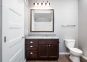 Thumbnail 20 of 44 - a bathroom with a toilet and a sink  at Victoria Park and V2 Apartments, St. Paul
