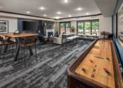 Thumbnail 15 of 42 - Indoor view of clubhouse equipped with game table and multiple seating areas  at The Whitley, St. Paul