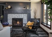 Thumbnail 13 of 42 - View of cozy clubhouse with fire place and seating area at The Whitley in St. Paul, MN.