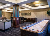 Thumbnail 24 of 44 - Resident Lounge with Shuffleboard  at Victoria Park and V2 Apartments, St. Paul, 55102