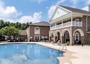 Thumbnail 13 of 25 - A large swimming pool at Puller Place Apartments, Jacksonville, North Carolina