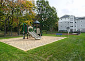 Thumbnail 34 of 35 - Play area for kids at The Promenade at Easton Apartments, Easton