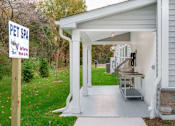 Thumbnail 23 of 35 - A pet spa sign is on a pole in front of a white building at The Promenade at Easton Apartments, Easton, 21601
