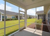 Thumbnail 8 of 21 - Interior Screen Patio View at River Oaks, South Carolina